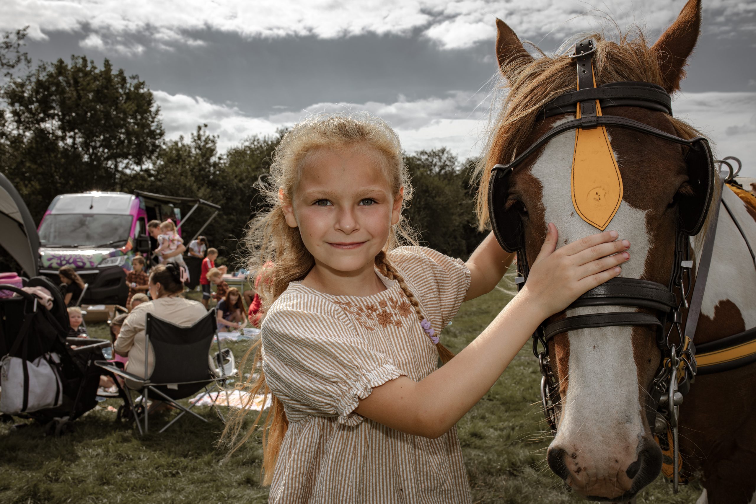 Girl standing next to a horse